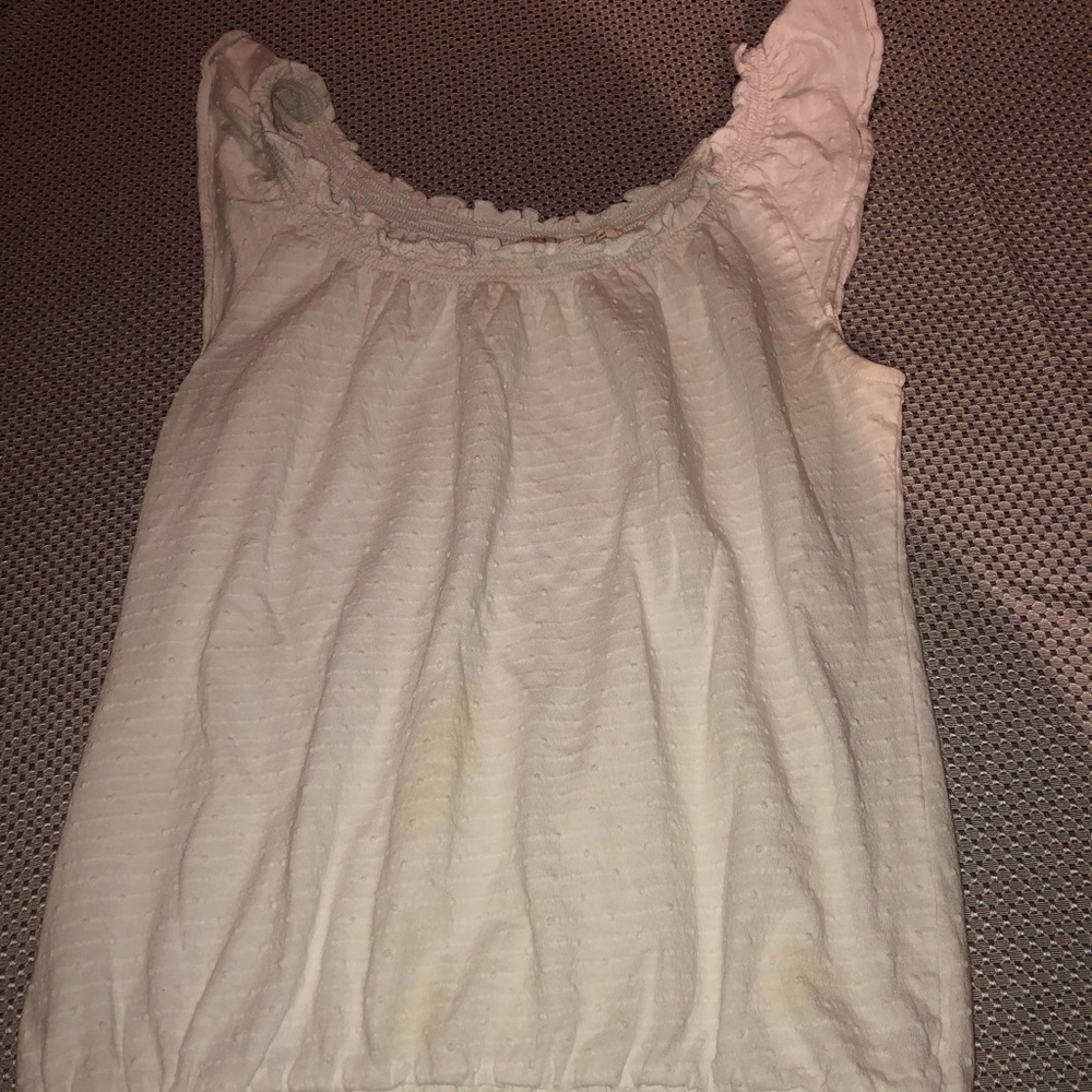 Like new white sleeveless shirt w/ruffled sleeves